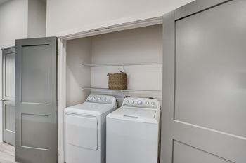 A laundry room with a washer and dryer.
